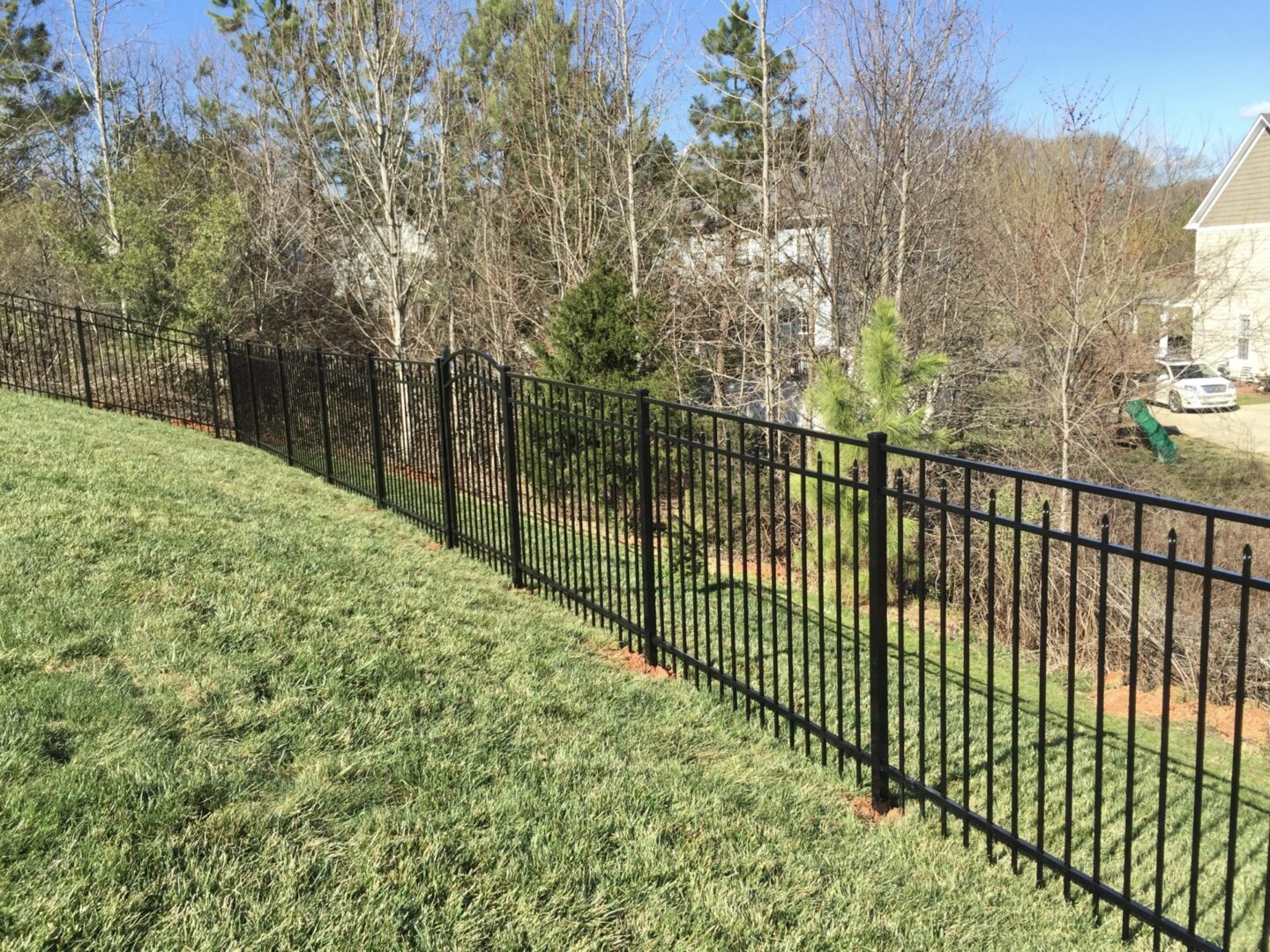 A fence that is made of black metal.